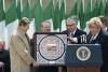 President Ronald Reagan being presented with coat of arms by Edmond Brennan in the village square in Ballyporeen, Ireland, 06/03/1984 President Ronald Reagan being presented with coat of arms by Edmond Brennan in the village square in Ballyporeen, Ireland, 06/03/1984