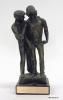 A bronze sculpture of a young man being consoled by another man is mounted on a black base. The base has a metal plaque engraved “To Nancy Reagan, For Your Commitment And Dedication To Saving The Young People Of Our Nation, Straight Inc., Cincinnati.” The sculpture was created by S. ED Kerschenheiter. First Lady Nancy Reagan visited several Midwestern states on 09/17/1984, including Ohio. She visited Straight Inc. in Cincinnati. Gifted by Cincinnati Straight, Inc. 