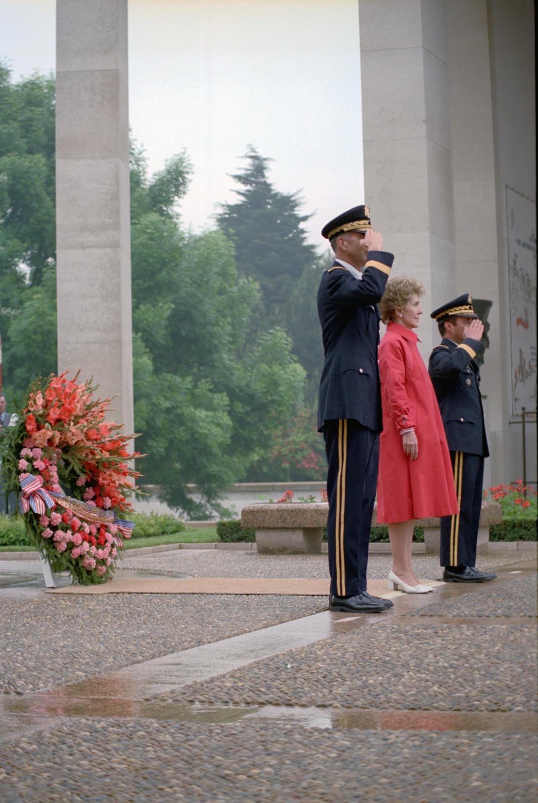 Nancy Reagan standing with  Brigadier General Donaldson and Brigadier General Patte during the memorial service at Omaha Beach Cemetery, 06/06/1982
