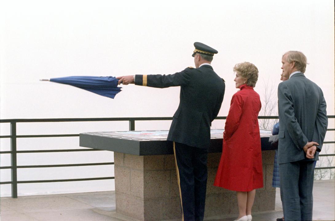 Nancy Reagan with group at plaque at Omaha Beach Cemetery. 
