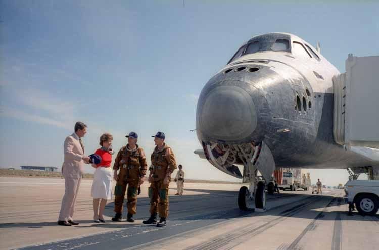 President Ronald Reagan and Nancy Reagan speaking with astronauts Captain Thomas Mattingly and Colonel Henry Hartsfield, Jr. as they disembarked from the Space Shuttle Columbia at Edwards Air Force Base in California 07/04/1982 C8961-36