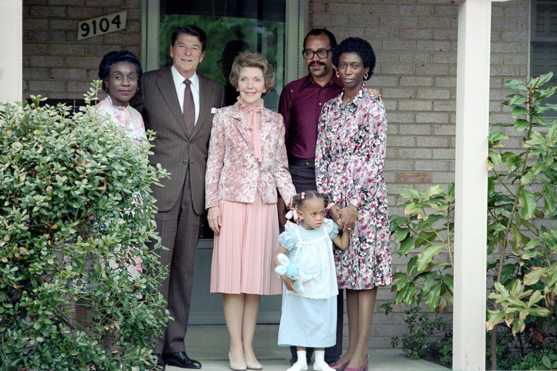  President Ronald Reagan and Nancy Reagan visiting with Philip Butler, Barbara Butler, Natasha Butler, and Dorothea Tolson as a result of an article which appeared in the May 3rd edition of the Washington Post. The Butlers had a cross burned on their front lawn five years early by a member of the Ku Klux Klan. 05/03/1982  NAID: 404525529