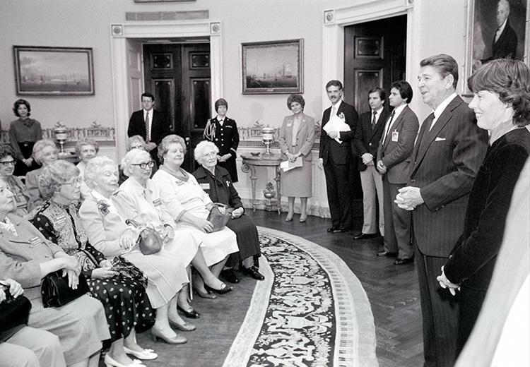 President Ronald Reagan meeting with World War II American women former Prisoners of War (POWs) in the Blue Room 04/08/1983 NAID: 276563641