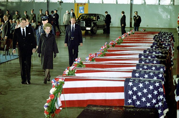 President Ronald Reagan and Nancy Reagan attending a ceremony in honor of the casualties of the U.S. Embassy bombing in Lebanon earlier in the week at Andrews Air Force Base 04/23/1983 NAID: 75852755