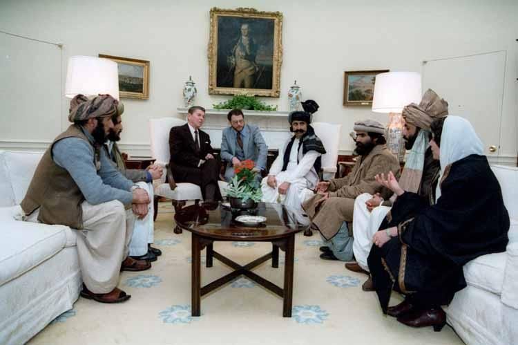 President Ronald Reagan meeting with Afghan Freedom Fighters to discuss Soviet atrocities in Afghanistan in the Oval Office 02/02/1983  NAID: 75852643