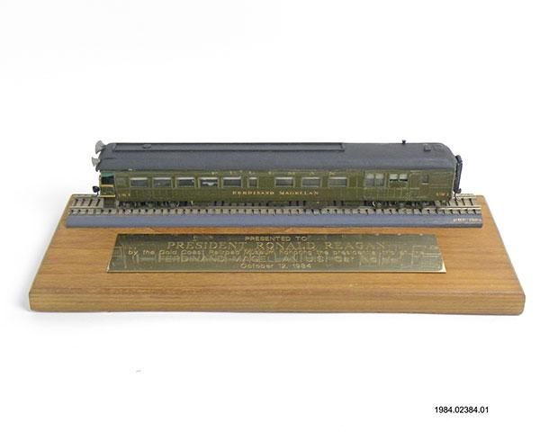 A "Ferdinand Magellan" Pullman Railroad Car model mounted on a wooden base with an engraved presentation plaque stating "PRESENTED TO PRESIDENT RONALD REAGAN by the Gold Coast Railroad Museum...."