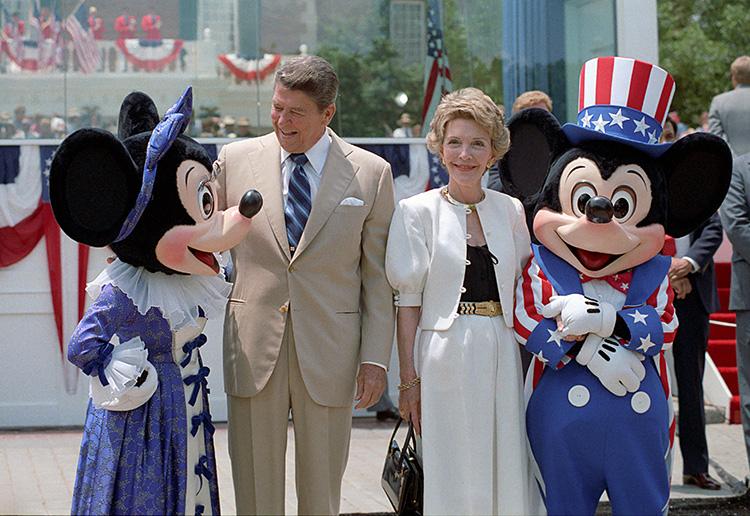 President Ronald Reagan and Nancy Reagan pose with Mickey Mouse and Minnie Mouse during their trip to EPCOT for the President’s Inaugural Bands Parade 05/27/1985  NAID: 276564147