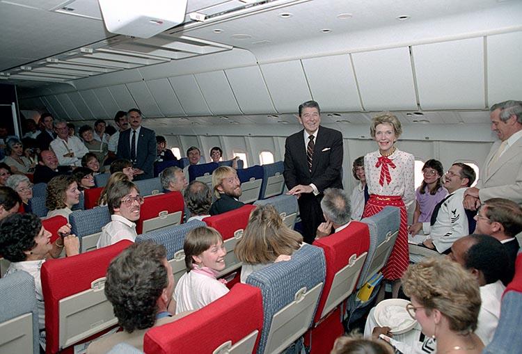 President Ronald Reagan and Nancy Reagan visiting with returning American hostages aboard TWA Flight 847 at Andrews Air Force Base 07/02/1985  NAID: 75854183