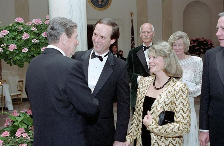 President Ronald Reagan speaking with Dr. Robert Ballard (who found the Titanic on 09/01/1985) and Marjorie Ballard in the Entrance Hall at a dinner for Princes Charles and Princess Diana of the United Kingdom 11/09/1985  NAID: 75854407