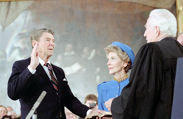 President Ronald Reagan being sworn in for his second term by Chief Justice Warren Burger with Nancy Reagan by his side in the rotunda of the U.S. Capitol in Washington, D.C. 01/21/1985  NAID: 75853881