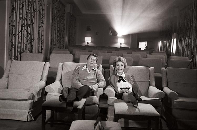 President Ronald Reagan and Nancy Reagan sitting in the White House Theater during a filming with an ABC production crew to be included in a Barbara Walters television special 02/26/1986 NAID: 276564321