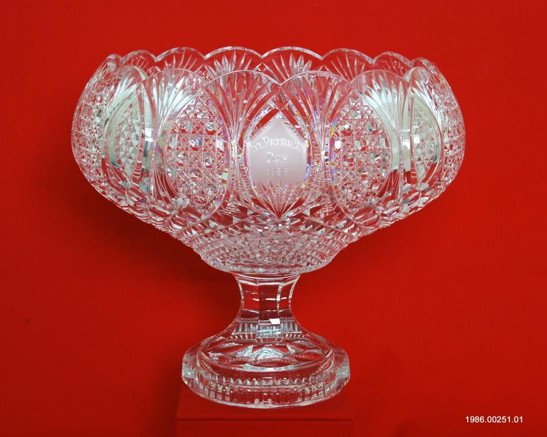 Originally filled with shamrocks, this Waterford crystal punch bowl, etched “St. Patrick’s Day 1986” was presented to President Ronald Reagan by Prime Minister Garret FitzGerald of Ireland in the White House Rose Garden on March 17, 1986. Gifter: Prime Minister Garret FitzGerald of Ireland. Artifact ID: 1986.00251.01