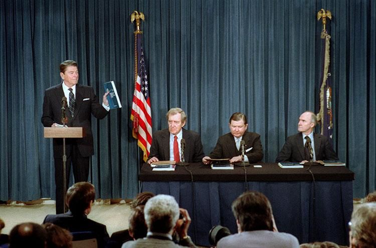 President Ronald Reagan delivering his Remarks on Receiving the Final Report of the President's Special Review Board on the National Security Council From left to right: Edmund Muskie, John Tower and Brent Scowcroft 02/26/1987  NAID: 75855307