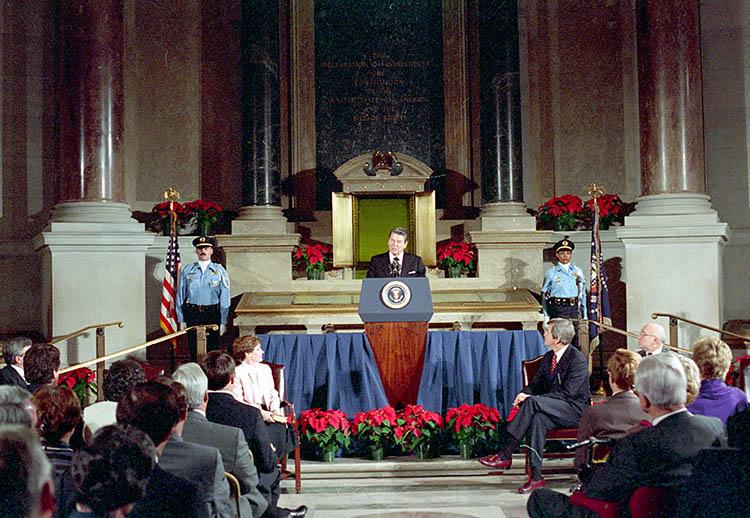 President Ronald Reagan delivering his Remarks at the Swearing-In Ceremony of Don W. Wilson as Archivist of the United States in the Rotunda at the National Archives in Washington, D.C. 12/04/1987 NAID: 75855843