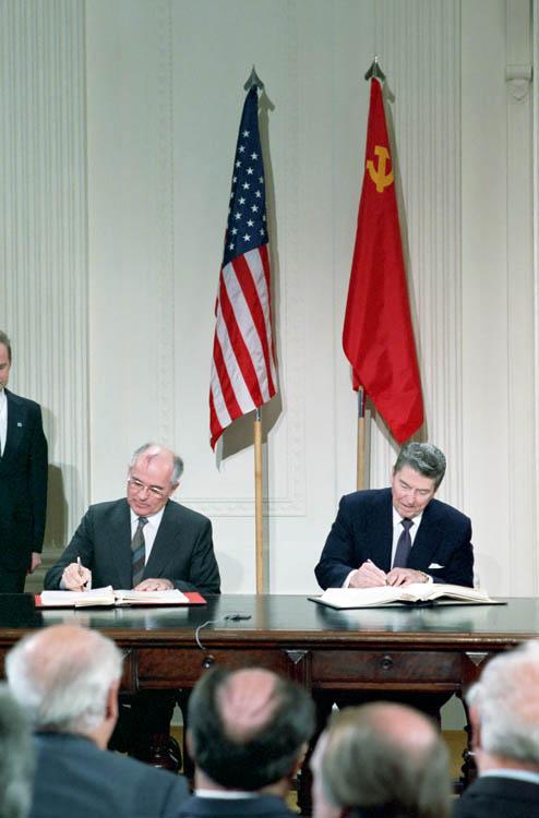 President Ronald Reagan and General Secretary of the Communist Party of the Soviet Union Mikhail Gorbachev signing the INF Treaty in the East Room of the White House 12/08/1987 NAID: 75855865