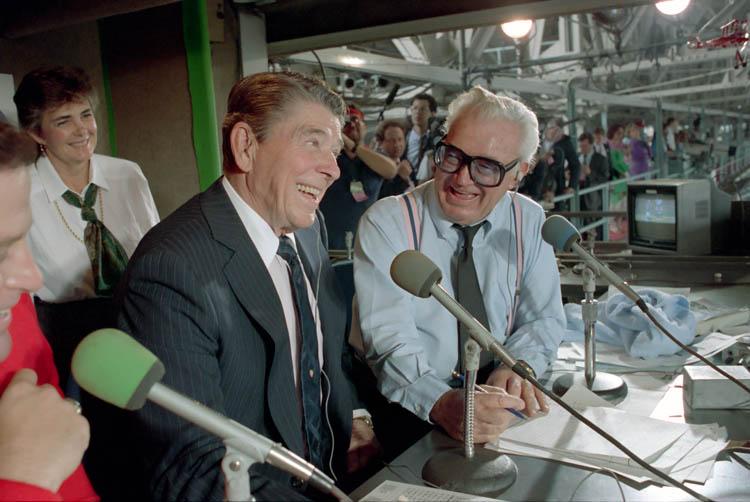 President Ronald Reagan in the press box with Harry Caray during a Chicago Cubs and Pittsburgh Pirates baseball game at Wrigley Field in Chicago, Illinois 09/30/1988  NAID: 75856295 