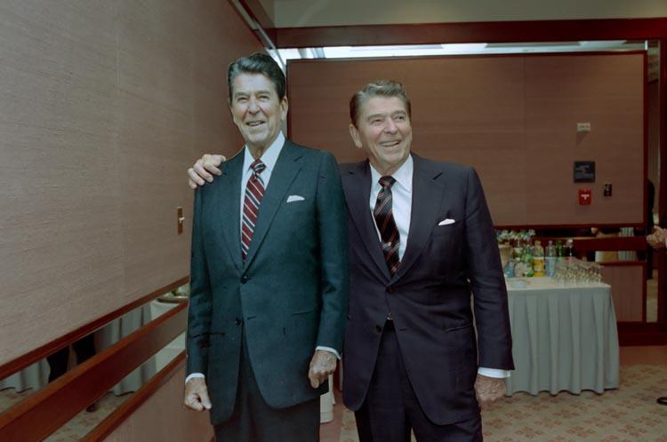 President Ronald Reagan posing with a cardboard cutout of himself at the Sheraton Grand Hotel in Washington, D.C. 10/03/1988  NAID: 75856299