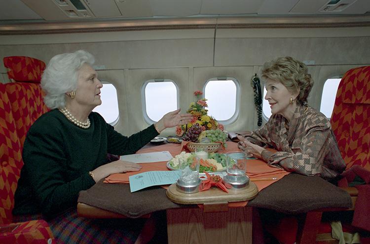 Nancy Reagan and Barbara Bush on the First Lady airplane returning to Andrews Air Force Base from New York 12/07/1988 NAID: 75856401
