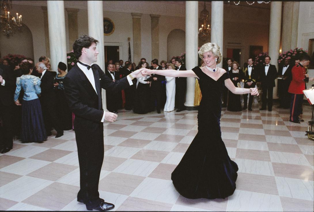 Diana’s Iconic “Travolta” Dress: On loan from Historic Royal Palaces, the dress Princess Diana wore while dancing with actor John Travolta to Saturday Night Fever Music in the Entrance Hall at a formal dinner on November 9, 1985.