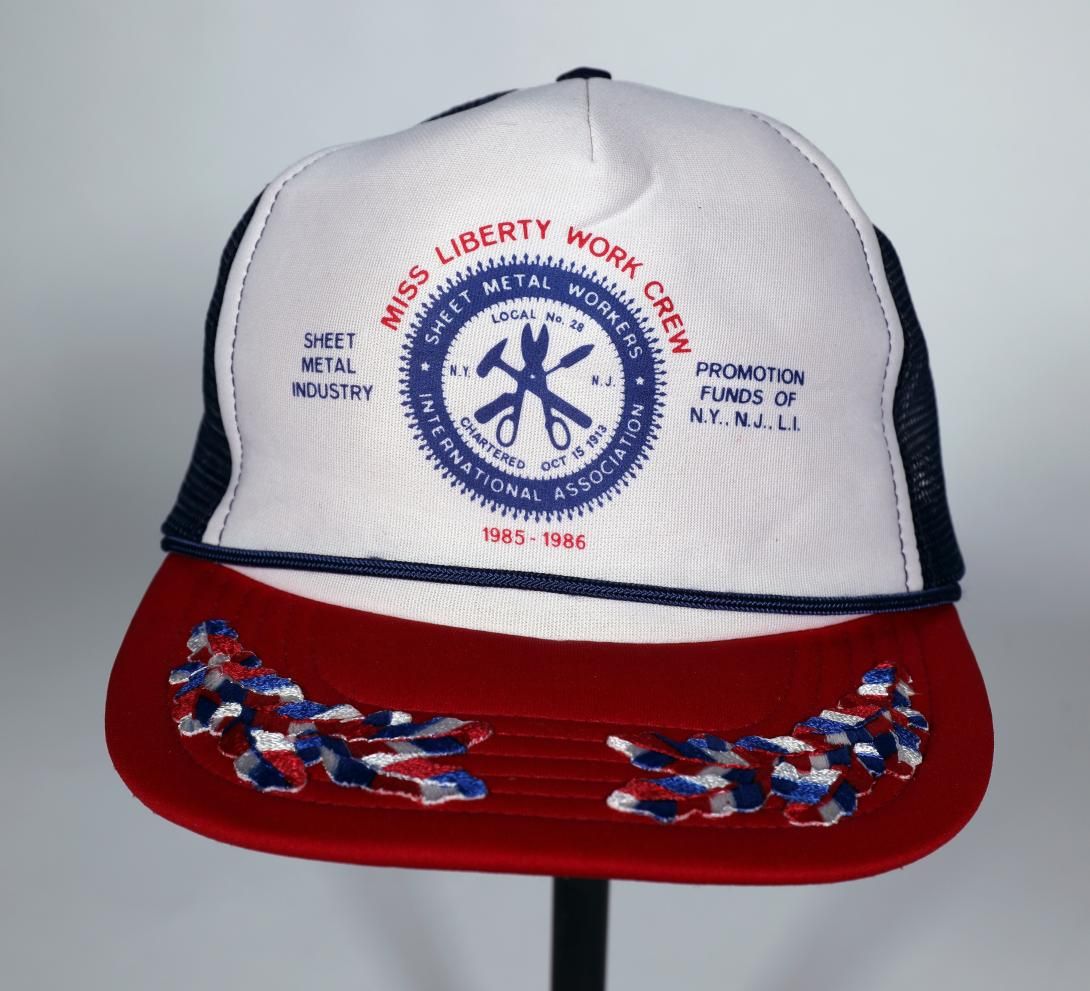 Baseball Cap, Miss Liberty Work Crew Hat Artifact ID: 1985.01123.03 Maker: Seville Metal Corporation Date Made: 1985.