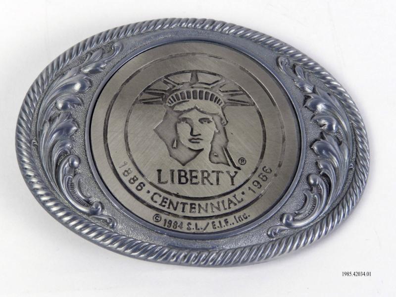 Belt Buckle, Statue of Liberty Centennial Artifact ID: 1985.42034.01 Gifter: Mark S. Weiner, Sr. Maker: Weingeroff Enterprises Inc. (Cranston, Rhode Island) Date: 1984