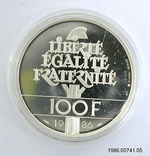 Commemorative Coin, 100 Francs Statue of Liberty (silver) [view 2 of 2] Artifact ID: 1986.00741.05a-b Gifter: François Mitterrand Date: 1986