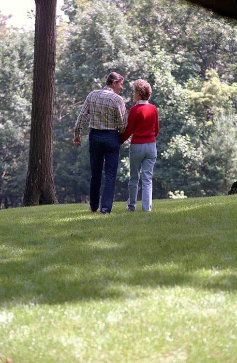 President Ronald Reagan and Nancy Reagan walking together during a filming session for the Tuesday Team and the 1984 campaign documentary at Camp David 07/08/1984 