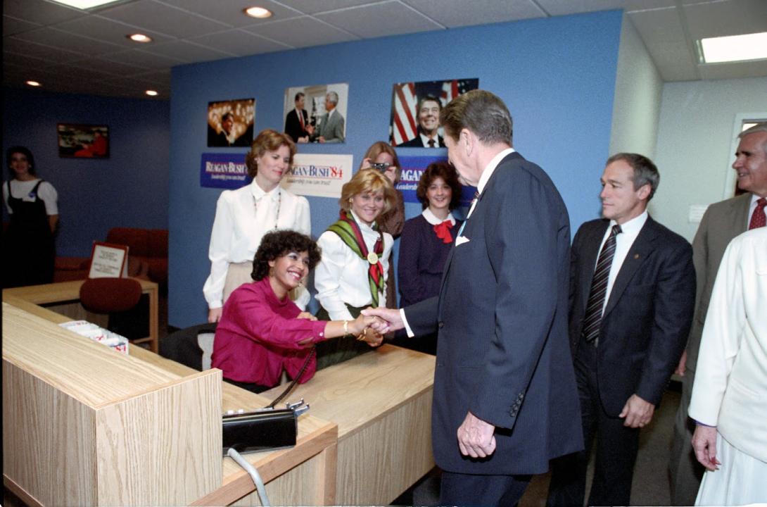 President Ronald Reagan shaking hands with staff while visiting the Reagan-Bush Campaign Headquarters in Washington, D.C. 10/31/1984 