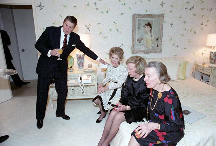 President Ronald Reagan and Nancy Reagan with Marion Jorgensen and an unidentified woman watching the election results at a private dinner at the Jorgensen residence in Los Angeles, California 11/06/1984