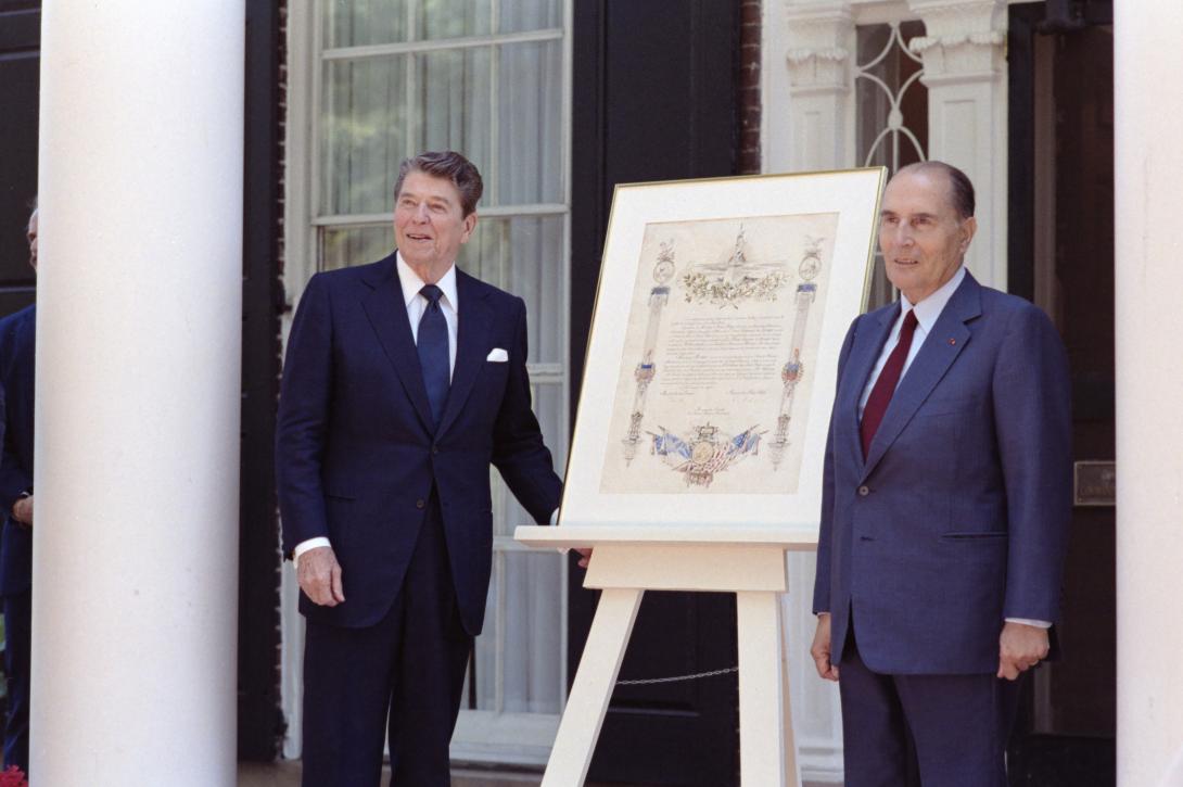 President Ronald Reagan and President François Mitterrand of France with the original deed of gift for the Statue of Liberty on the front steps of the Admiral’s House on Governors Island in New York Harbor 07/04/1986