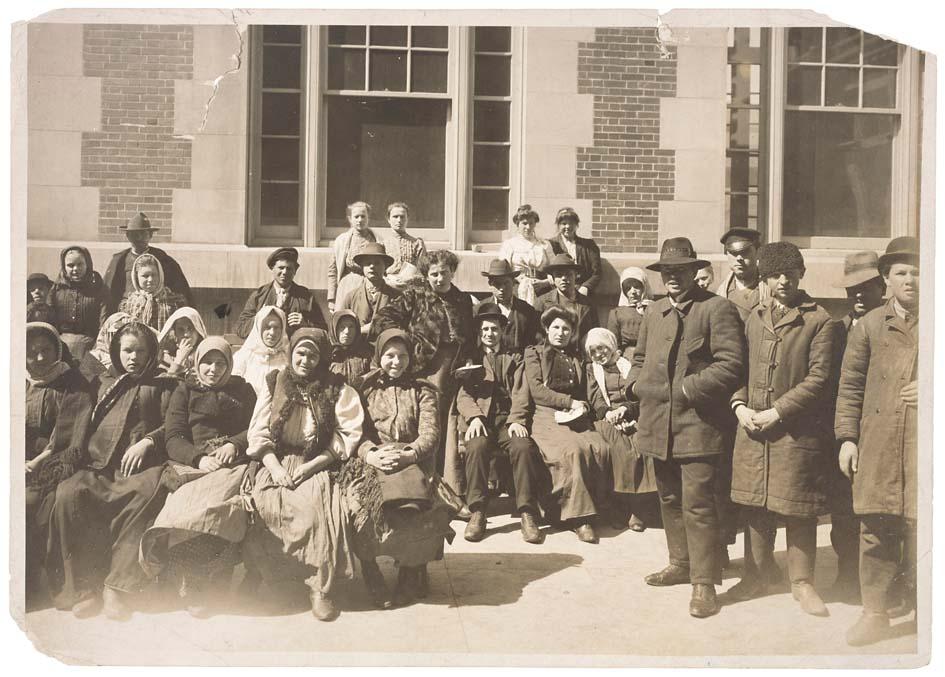 Photograph of a Group of Immigrants Outside a Building on Ellis Island Public Health Service Historical Photograph File 1880-1943 Record Group 90 Records of the Public Health Service 19794-1990 NAID: 595669