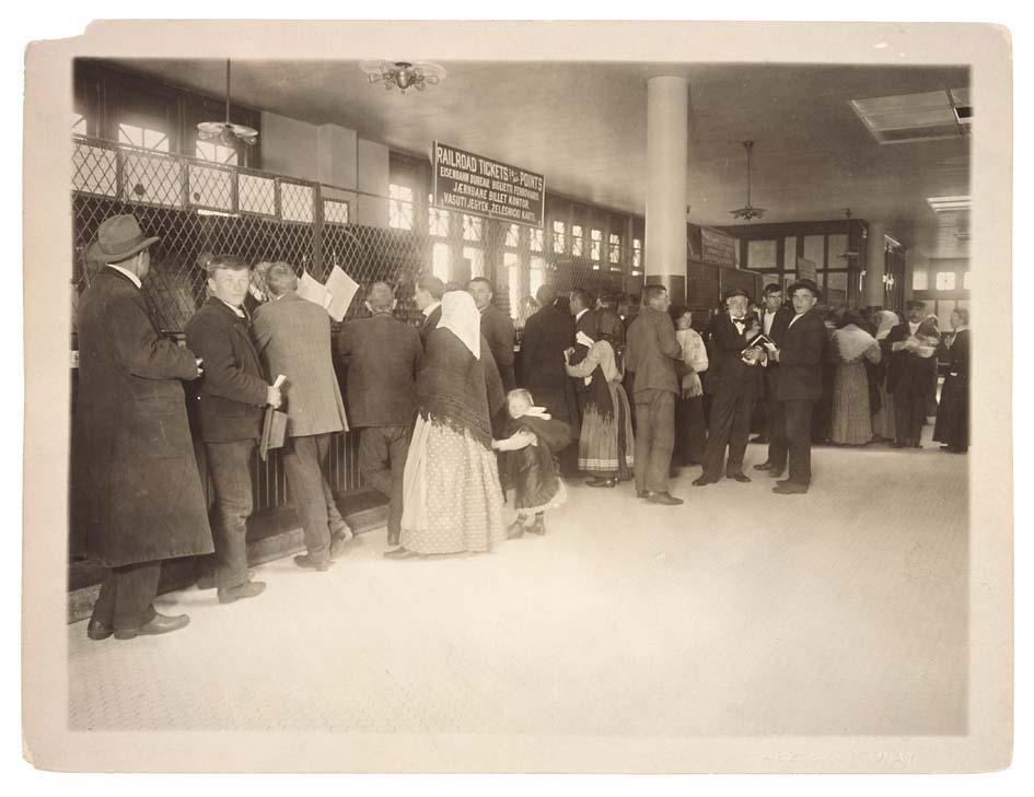 Photograph of Immigrants Buying Railroad Tickets on Ellis Island Public Health Service Historical Photograph File 1880-1943 Record Group 90 Records of the Public Health Service 1794-1990. NAID: 595656