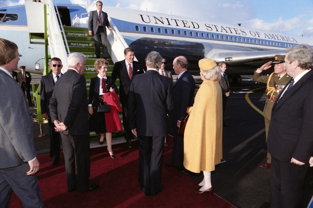 President Ronald Reagan and Nancy Reagan walking off Air Force One at Shannon Airport in Ireland meeting President Patrick Hillery, Maeve Hillery, Prime Minister Garret FitzGerald, Joan O’Farrell FitzGerald, Deputy Prime Minister Dick Spring, Kirsti Spring, Minister for Foreign Affairs Peter Barry, Margaret Barry, Minister for Justice Michael Noonan, and Irish Ambassador Tadhg F. O’Sullivan, C22213-06, 06/01/1984