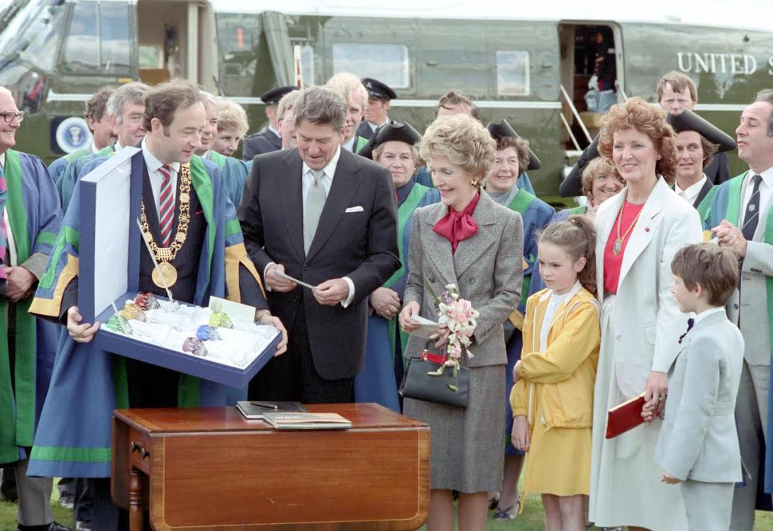 President Ronald Reagan and Nancy Reagan receiving gifts from Lord Mayor of Dublin Michael Keating and Lady Mayoress of Dublin Kathryn Keating during a trip to Dublin, Ireland, 06/03/1984