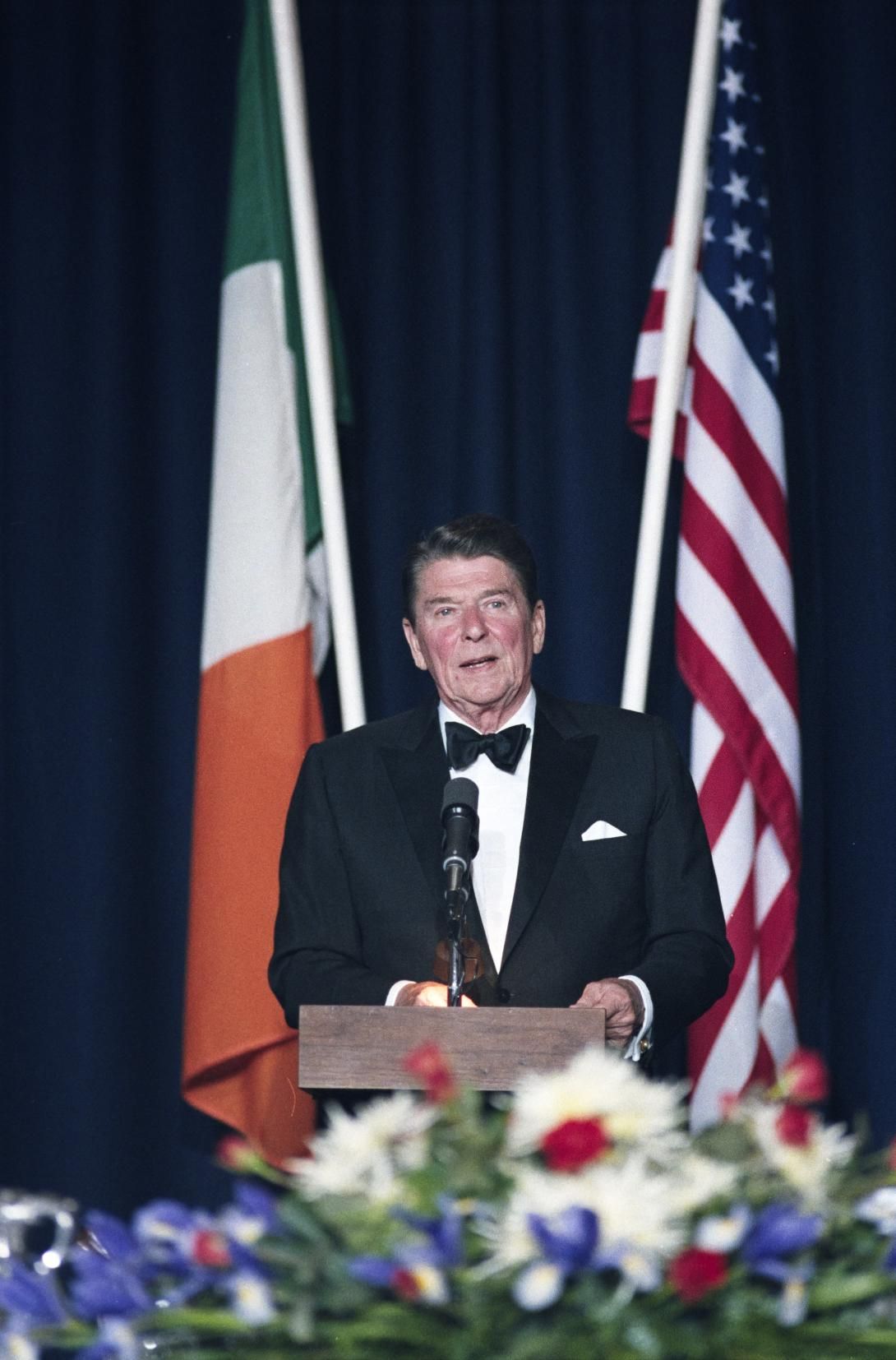 President Ronald Reagan speaking at the podium during the State Dinner at Dublin Castle in Dublin, Ireland, 06/03/1984