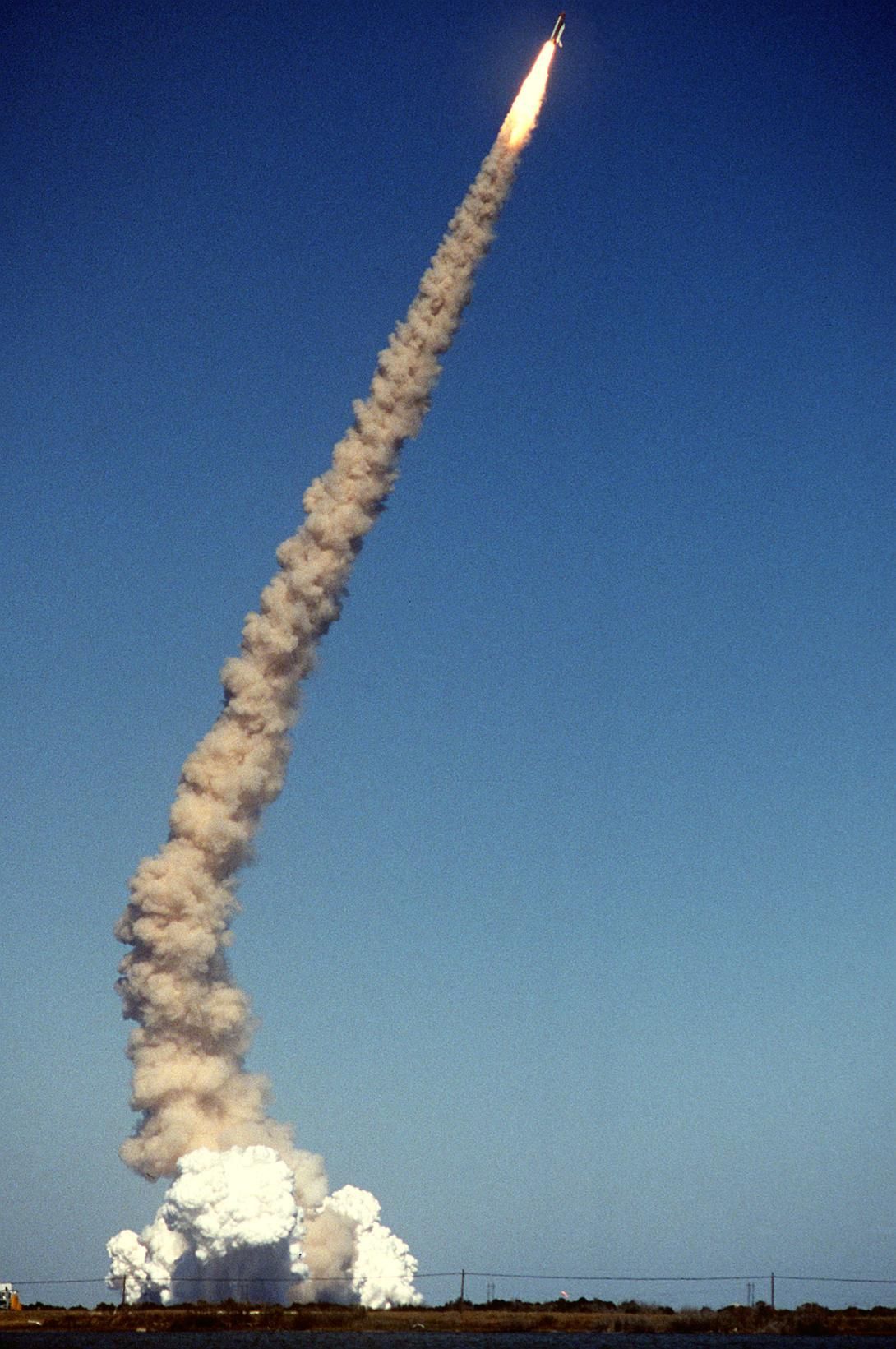 The Space Shuttle Challenger lifts off from its launch pad at the Kennedy Space Center. Third view in a series of eight. Record Group 330: Records of the Office of the Secretary of Defense 1921-2008 Series: Combined Military Service Digital Photographic Files 1982-2007. Produced: January 28, 1986. Local ID: 330-CFD-DF-ST-87-03667. NAID: 6413310.