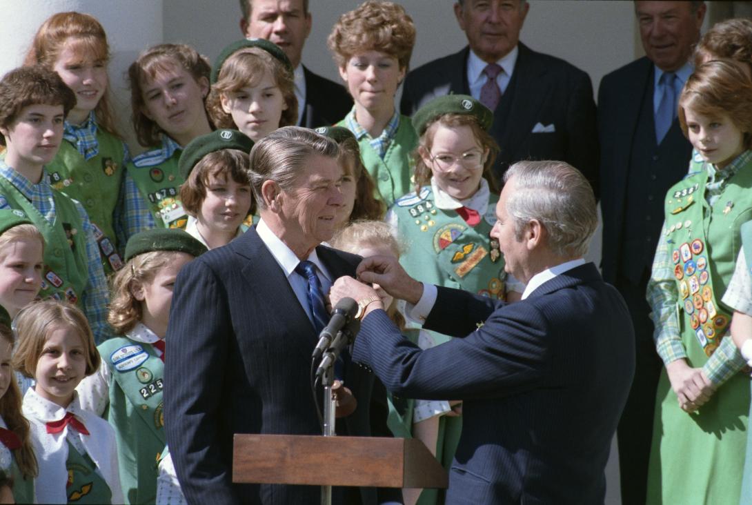 President Ronald Reagan receiving a shamrock pin from Irish Ambassador Tadhg O’Sullivan at a ceremony in celebration of St. Patricks’ Day, 03/15/1985
