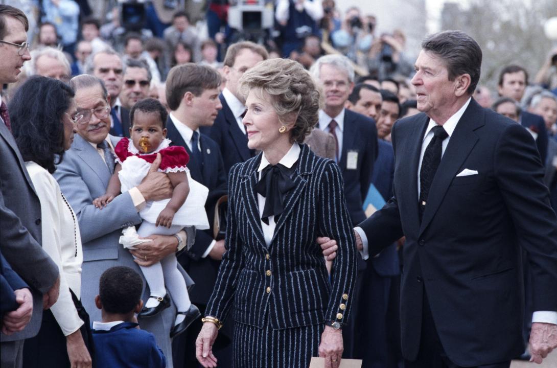 Nancy Reagan and President Ronald Reagan leaving the memorial service for the crew of the Space Shuttle Challenger. 01/31/1986. C33147-33A.