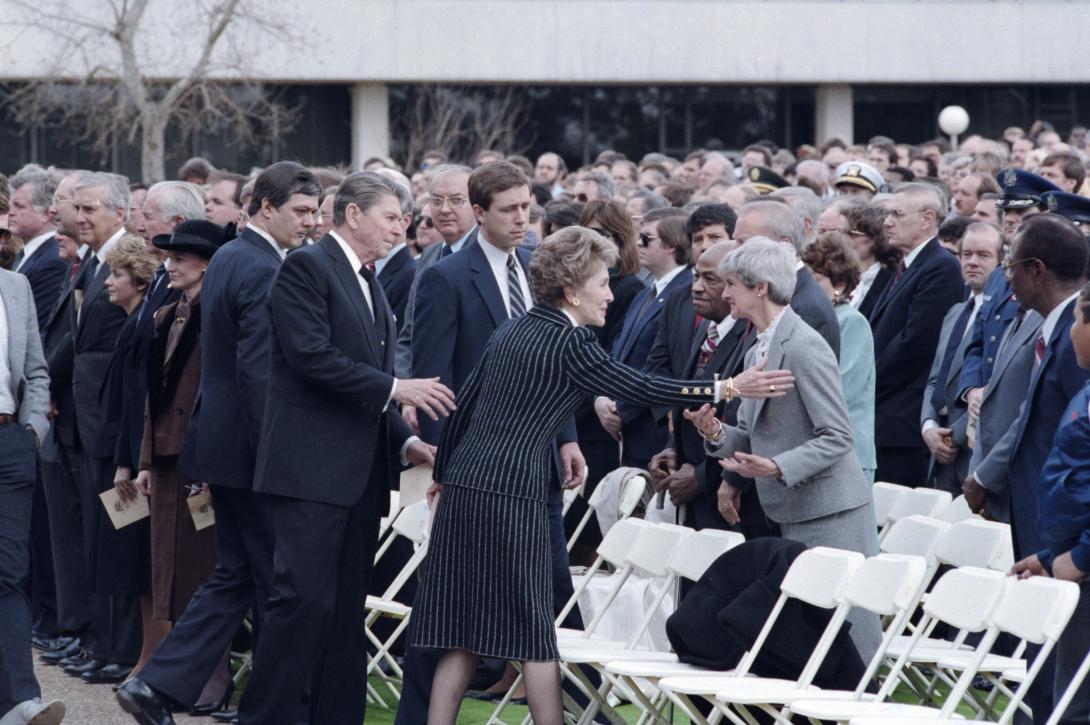 President Ronald Reagan and Nancy Reagan arriving at their seats at the memorial service for the crew of the Space Shuttle Challenger in Houston, Texas. 01/31/1986. C33152-17.