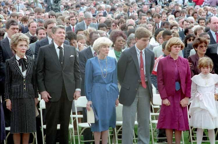 President Reagan and Nancy Reagan sitting with the families of the crew of the Space Shuttle Challenger at the memorial service for the space shuttle crew at the Johnson Space Center in Houston, Texas. 01/31/1986. C33141-14. NAID: 75854579.
