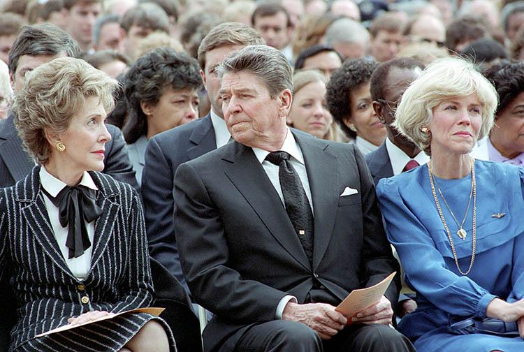 President Ronald Reagan and Nancy Reagan at the memorial service for the crew of the Space Shuttle Challenger at the Johnson Space Center in Houston, Texas. C33147-8A. NAID: 75854581.