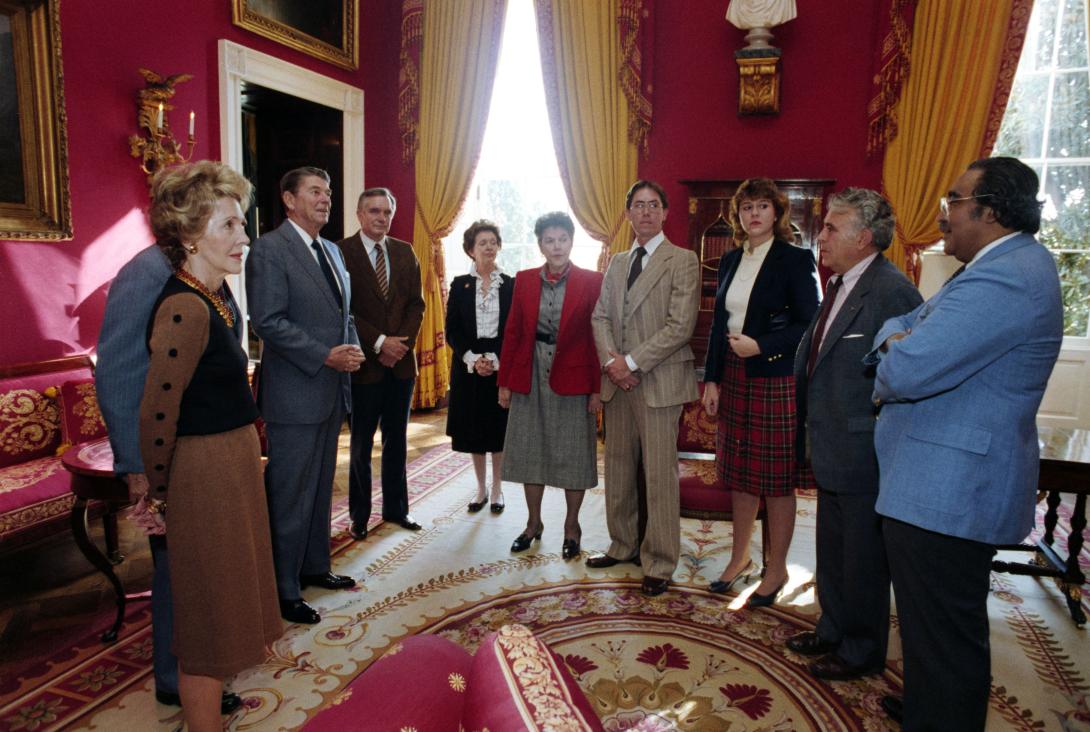 President Ronald Reagan and Nancy Reagan talking with guests in the Red Room during the signing ceremony for Proclamation 5123 – National Drug Abuse Education Week dated 11/01/1983