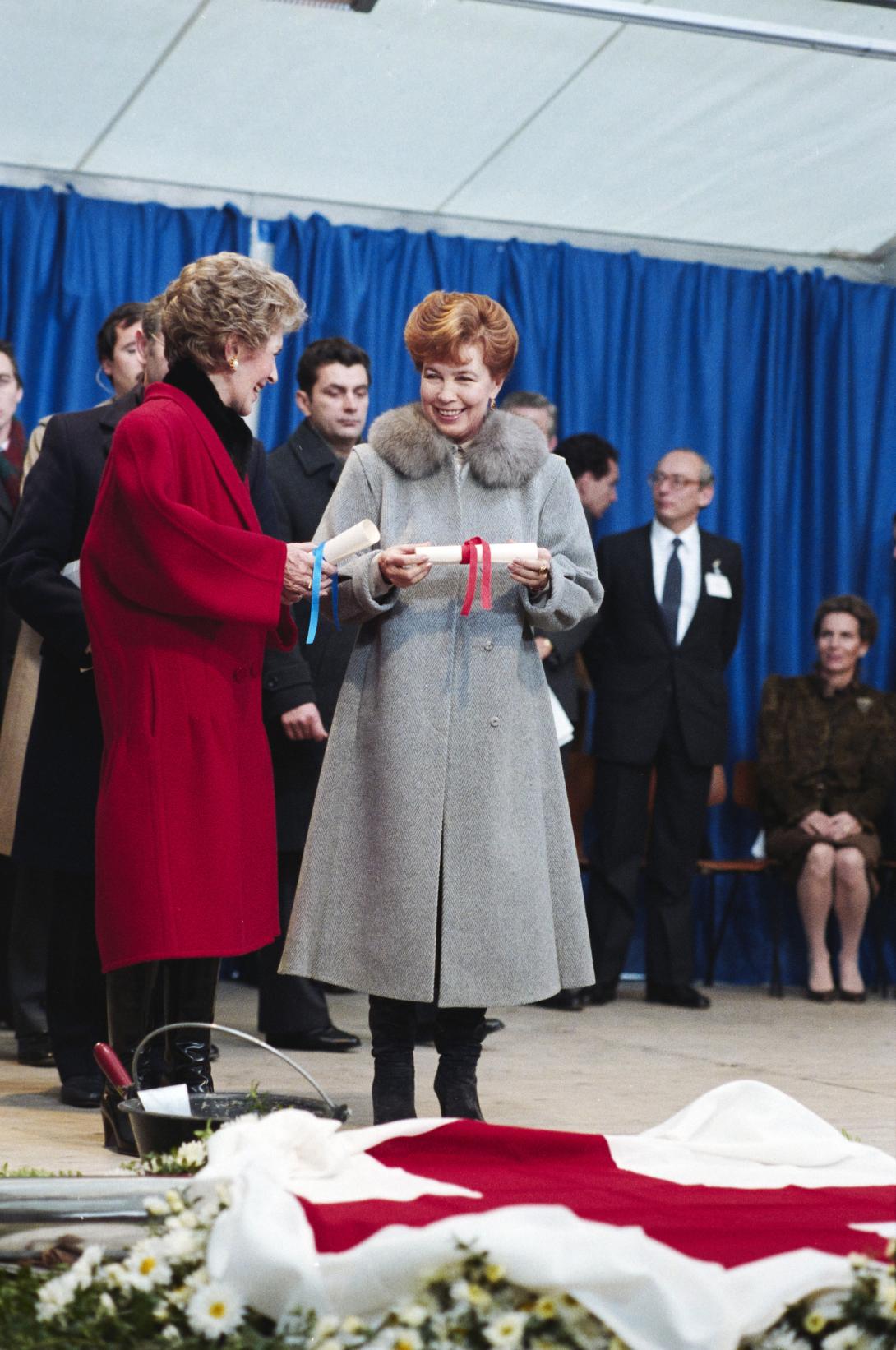 Nancy Reagan and Raisa Gorbachev attending the International Red Cross time capsule event in Geneva, Switzerland, 11/20/1985