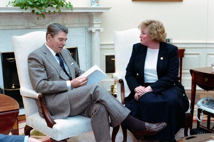 President Ronald Reagan meeting with Lois Herrington to receive the report of the White House Conference for a Drug Free America in the Oval Office dated 06/28/1988