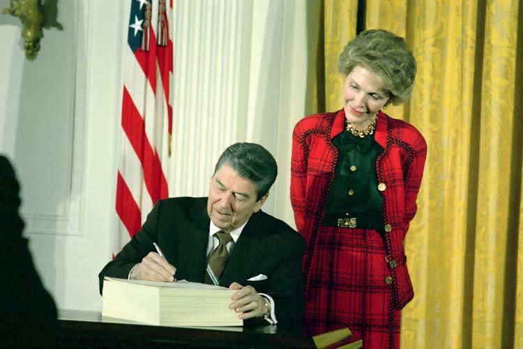 President Ronald Reagan, with Nancy Reagan, signing H.R.5210 the Anti-Drug Abuse Act of 1988 in the East Room dated 11/18/1988 NAID: 75856383