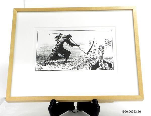"We’re Doing The Best We Can", cartoon - A Pat Oliphant political cartoon, matted in white and in a light wood frame, titled We're Doing the Best We Can. The grim reaper, labeled, "DRUGS," is attacking people with a machete and Reagan is pointing to a button that says, "JUST SAY NO." Reagan: WELL . . . WE'RE DOING THE BEST WE CAN. Punk: Just say, "Well"