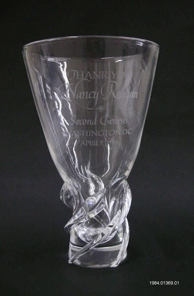 Stuben Crystal Vase - with a twist design at the base. The vase is etched with text stating, “THANK YOU, Nancy Reagan, SECOND GENESIS, WASHINGTON, D.C., APRIL 3, 1984.” First Lady Nancy Reagan was given the vase at the Second Genesis Center for Drug Rehabilitated Youths dinner held at the Washington, DC Marriott Hotel on 04/03/1984. It was presented to her by one of the Second Genesis graduates. Gifted by Dr. Sidney Shankman.