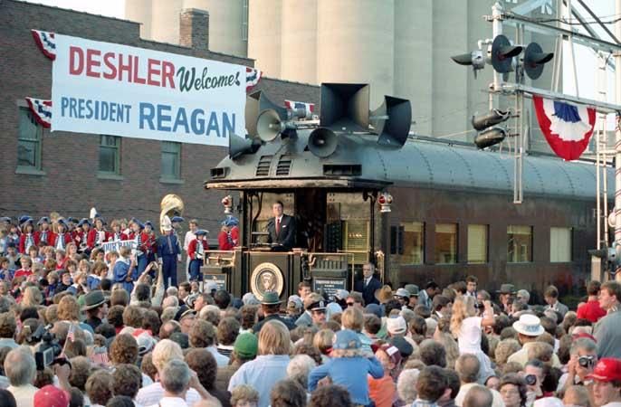 President Ronald Reagan aboard the <em> Ferdinand Magellan </em> railcar delivering remarks in Deshler, Ohio during the whistle-stop tour through Ohio 10/12/1984
