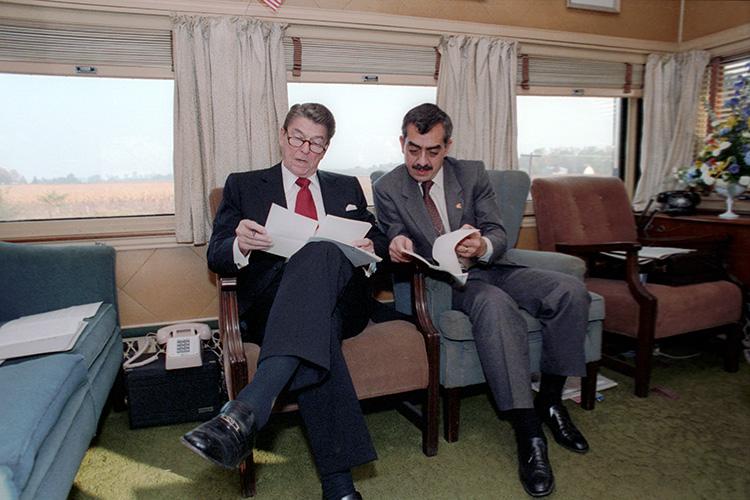 President Ronald Reagan working with Ken Khachigian aboard the <em>Ferdinand Magellan</em> railcar during the whistle-stop tour through Ohio 10/12/1984 